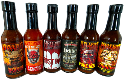 Seven bottles of Hellfire hot sauce with various labels on a white background
