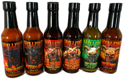 Seven bottles of Hellfire hot sauce with various labels on a white background
